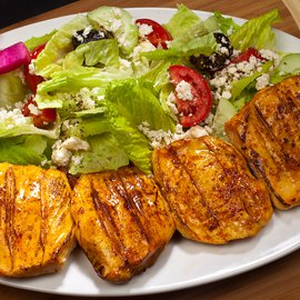 Image of CHICKEN BREAST ON GREEK SALAD plate