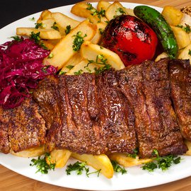 Image of ARGENTINIAN SKIRT STEAK with garlic fries